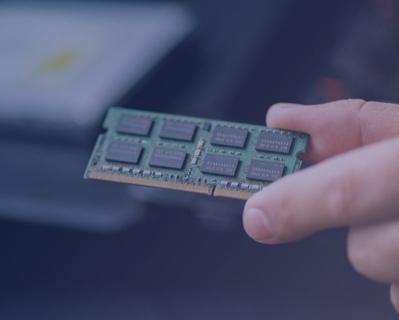 A person holding a semiconductor chip.